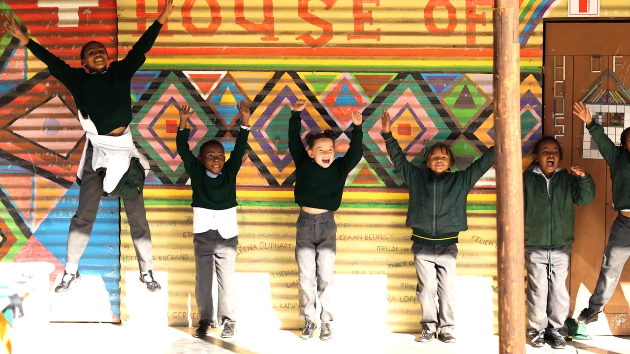 Children in the yard at House of Hope and Glory, from the film Hope Lives Here